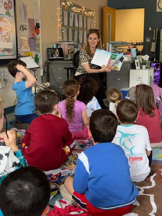 Christine Devane reading to students at Igo School in Foxborough