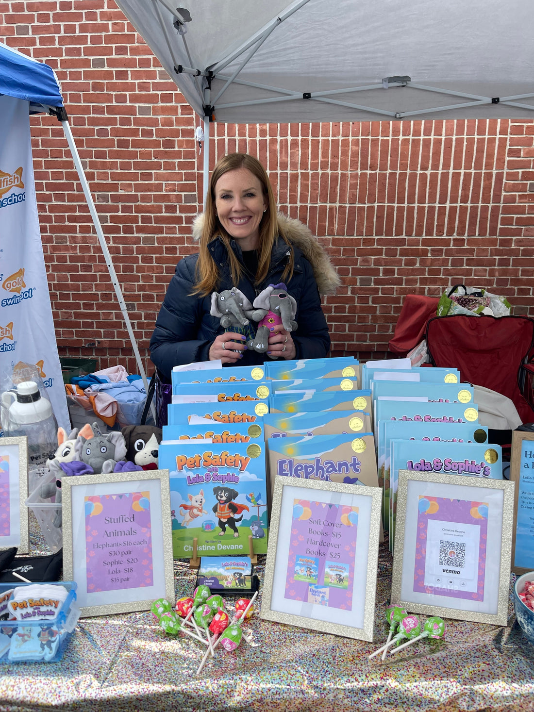 Christine Devane at her Walpole Day booth with Pet Safety books and stuffed animals